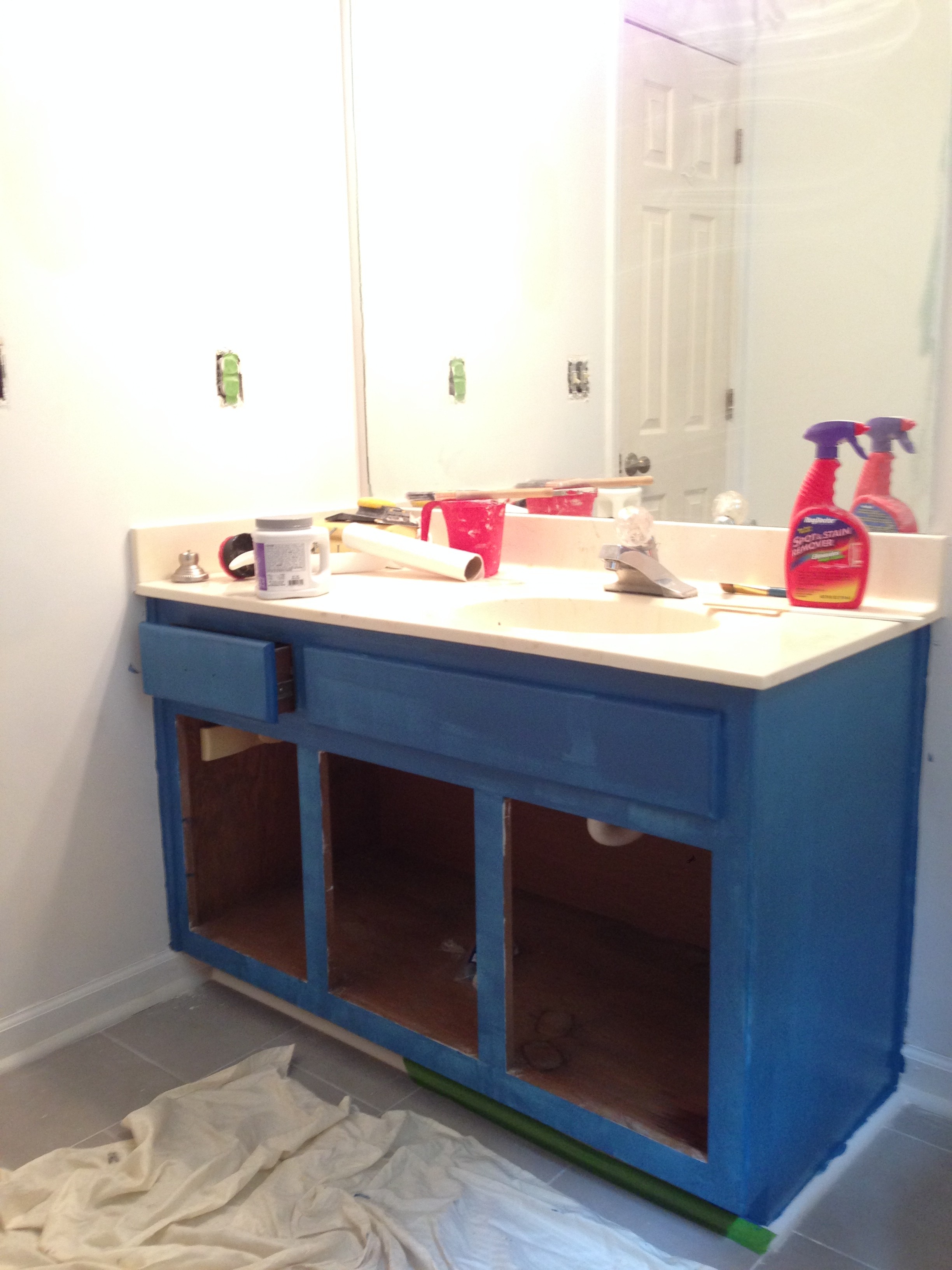 Back at it –  guest bathroom blue & brass